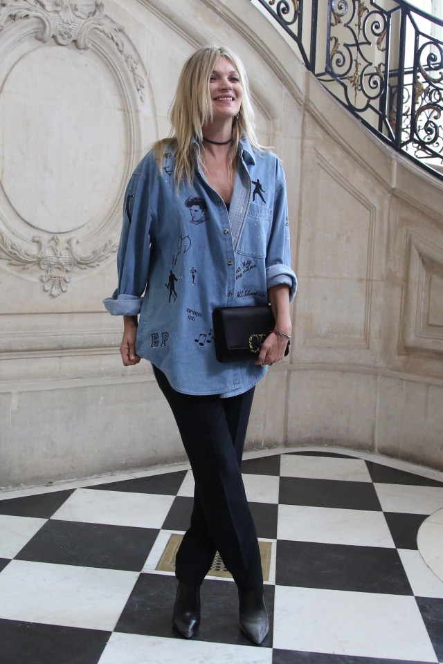  Kate Moss attended the Dior show at Paris Fashion Week wearing a baggy denim shirt and black dress pants