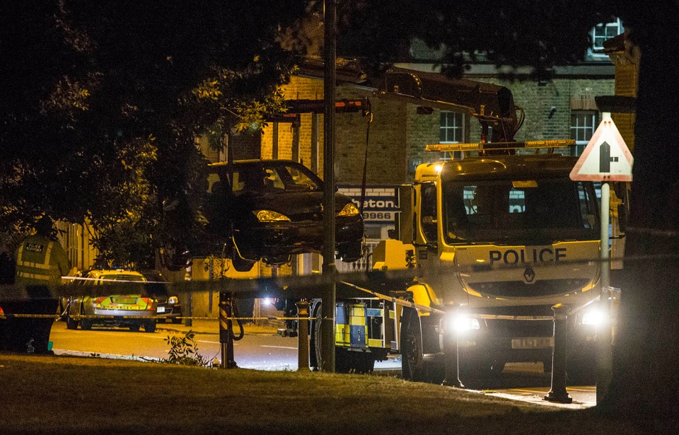  A police tow truck lifts crashed Ford Fiesta car into the air in Penge