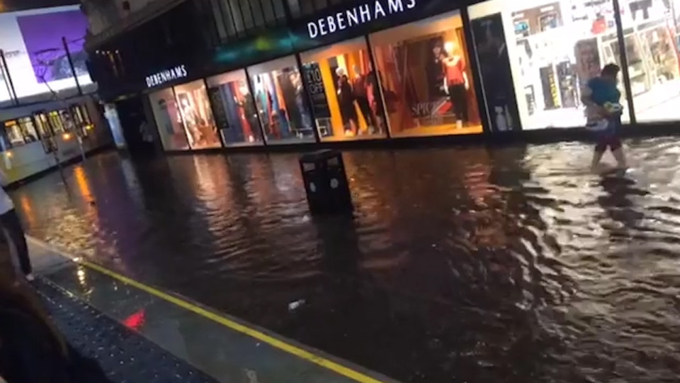 Tramlines turned to canals flowing through the city centre after torrential downpours