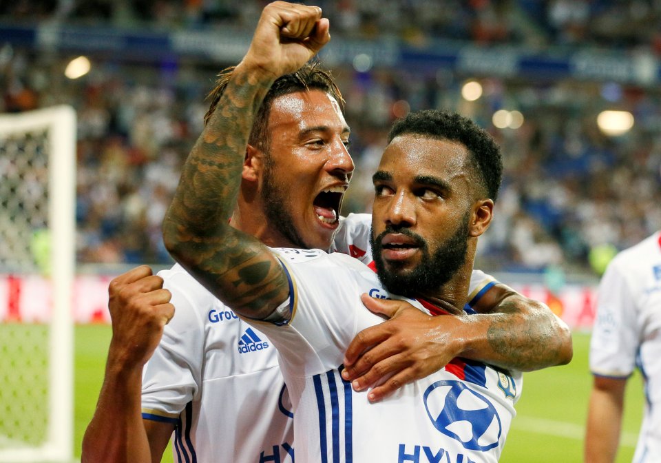 Football Soccer - Olympique Lyon v Caen - French Ligue 1 - Grand Stade stadium, Decines, France - 19/8/2016 Olympique Lyon's Alexandre Lacazette (R) and Corentin Tolisso after scoring a penalty against Caen REUTERS/Robert Pratta