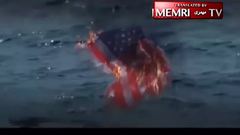  An American flag is seen burning at the end of the clip