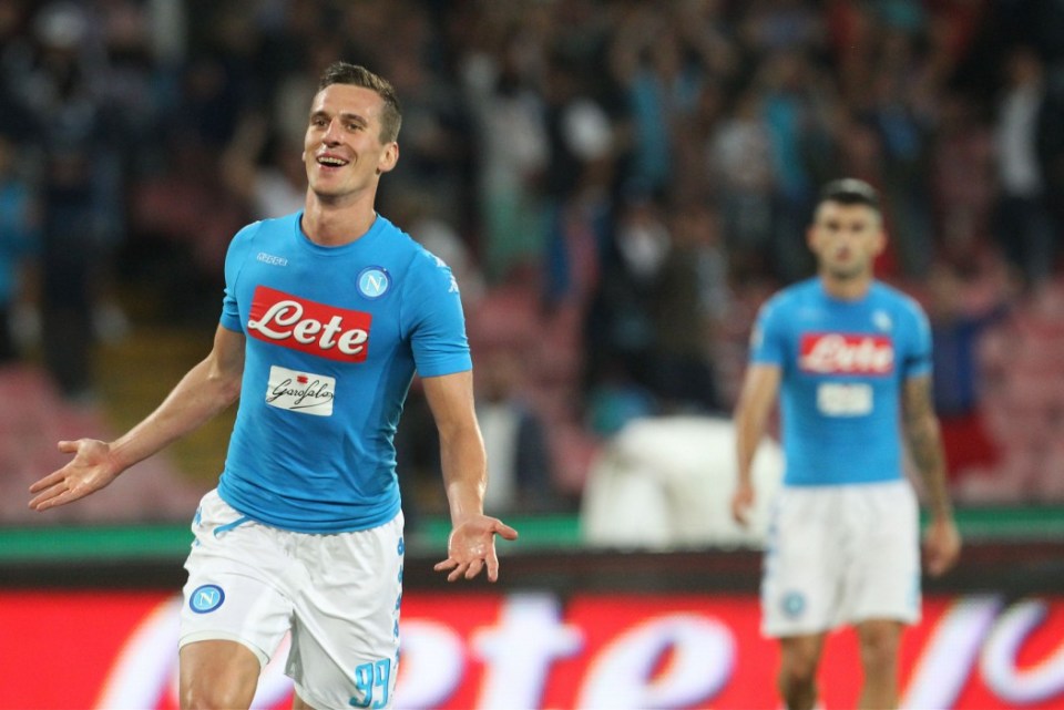 Napoli's Polish forward Arkadiusz Milik celebrates after scoring during the Italian Serie A football match SSC Napoli vs Bologna FC on September 17, 2016 at the San Paolo stadium, in Naples. / AFP PHOTO / CARLO HERMANNCARLO HERMANN/AFP/Getty Images