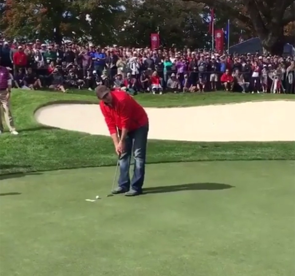 The man lines up the putt after being invited onto the green