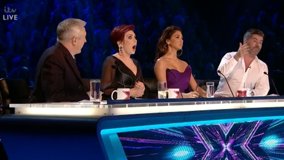  Sharon looked shocked by Simon's remarks about Louis