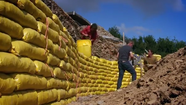  The walls of the house are made up of bags full of sand and stones, which family and friends helped put in