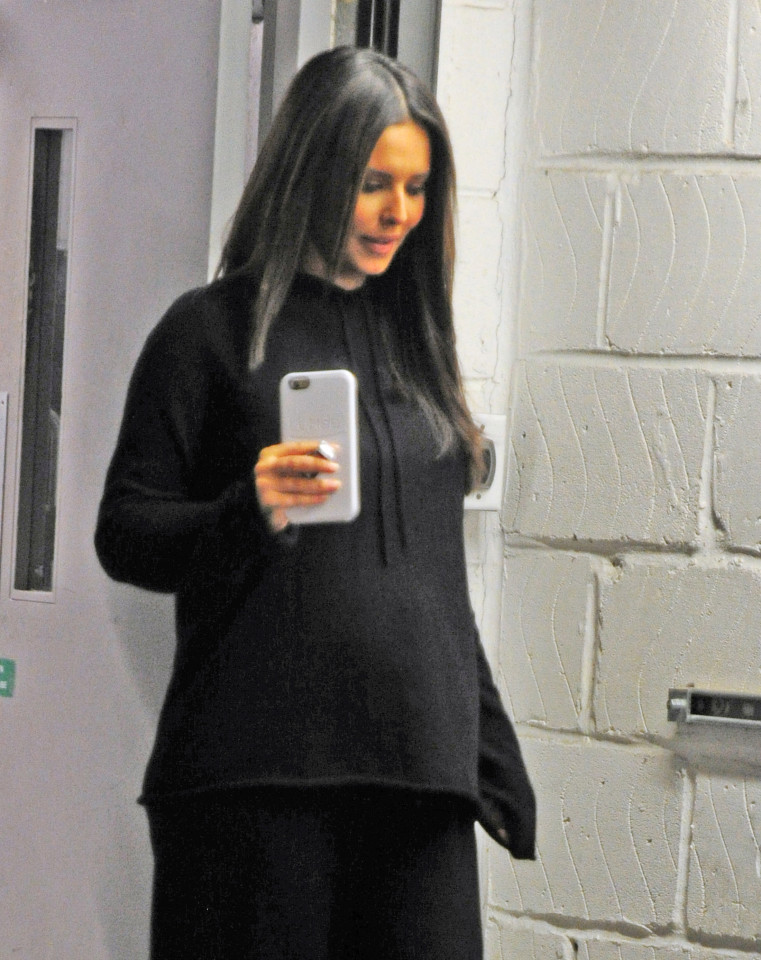  Cheryl appeared to show off a bump after her perfume signing in London last week