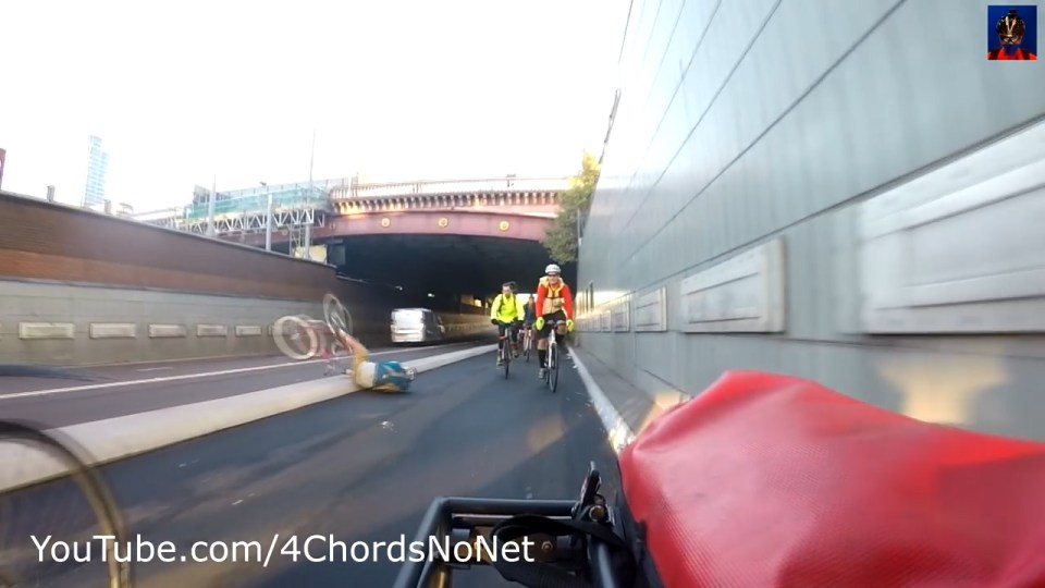  The male cyclist smacks onto the tarmac but his bike ends up in the road