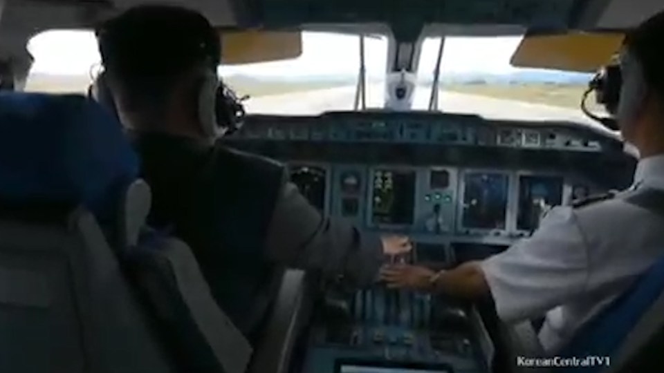  Assisted by a co-pilot, the North Korean leaders gets the plane off the ground