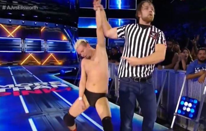 Dean Ambrose raises Ellsworth's arm gifting him victory