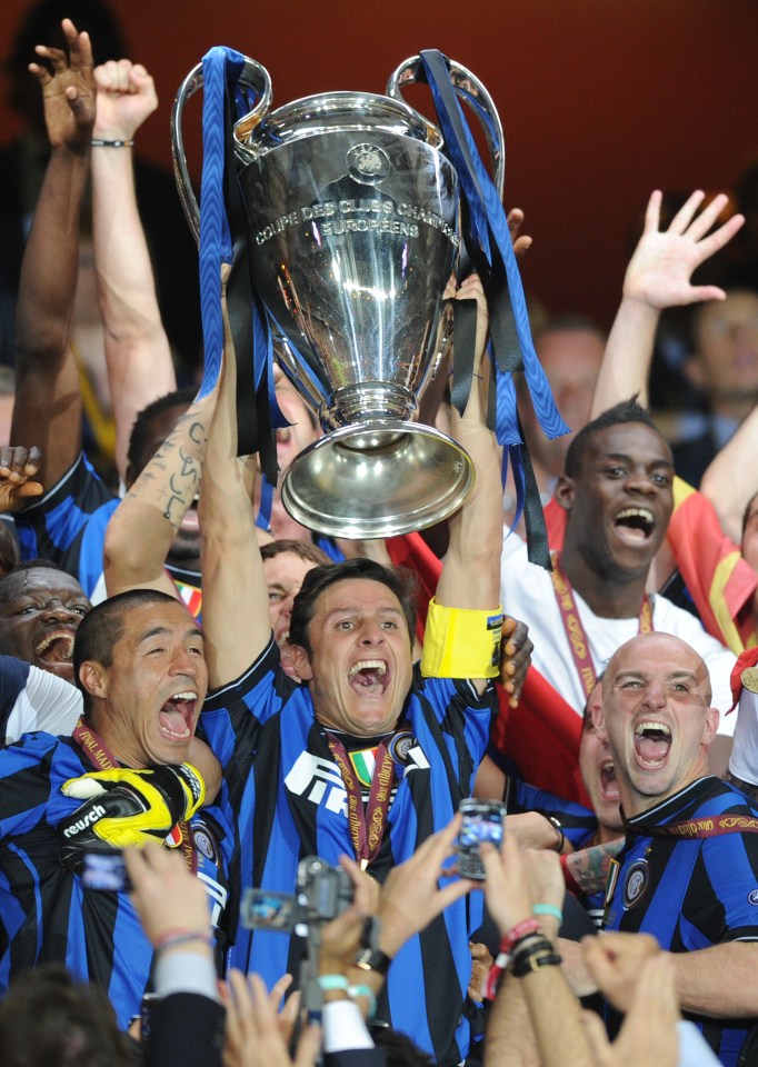 Inter Milan's Argentinian defender and captain Javier Aldemar Zanetti celebrates with the trophy after winning the UEFA Champions League final football match Inter Milan against Bayern Munich at the Santiago Bernabeu stadium in Madrid on May 22, 2010. Inter Milan won the Champions League with a 2-0 victory over Bayern Munich in the final at the Santiago Bernabeu. Argentine striker Diego Milito scored both goals for Jose Mourinho's team who completed a treble of trophies this season. AFP PHOTO / CHRISTOPHE SIMON (Photo credit should read CHRISTOPHE SIMON/AFP/Getty Images)