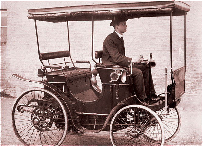  On the road. Motoring enthusiast Charles Rolls (1877–1910) driving his first car in 1896. Before that year, motorists were limited to 4 miles per hour in the country and 2 miles per hour in town, and someone had to walk in front with a flag or lantern