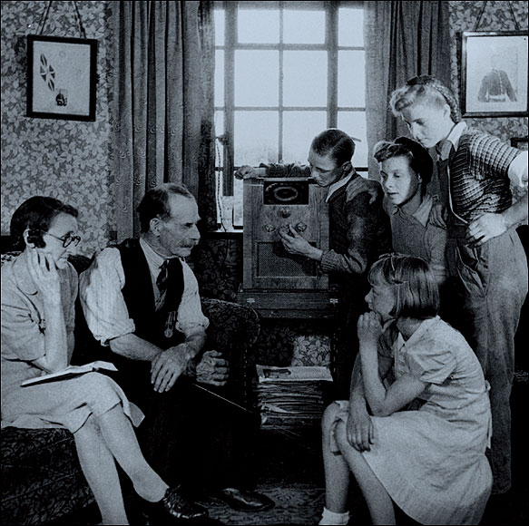  From the 1920s, radio became a way in which the public could be entertained and informed. This family, photographed in 1945, is listening in to a broadcast by Winston Chruchill (1874–1965)