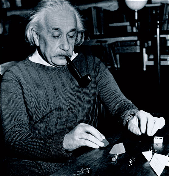  Einstein, pictured in 1933, solving a puzzle sent to him by a child – Einstein’s fame spread to every age group and every nation.