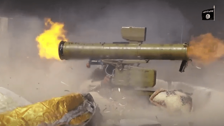  The chilling footage shows fighters cheering when the rockets hit their targets