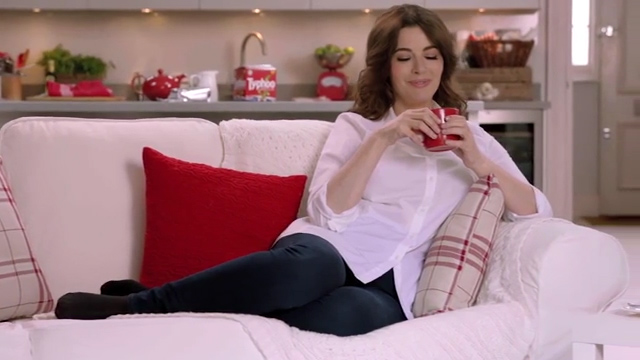 She appeared with a cup of Typhoo and a slice of chocolate cake in an advert