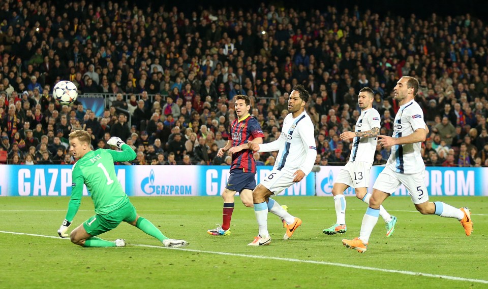  Lionel Messi scores against Manchester City during Barcelona's home win in 2014