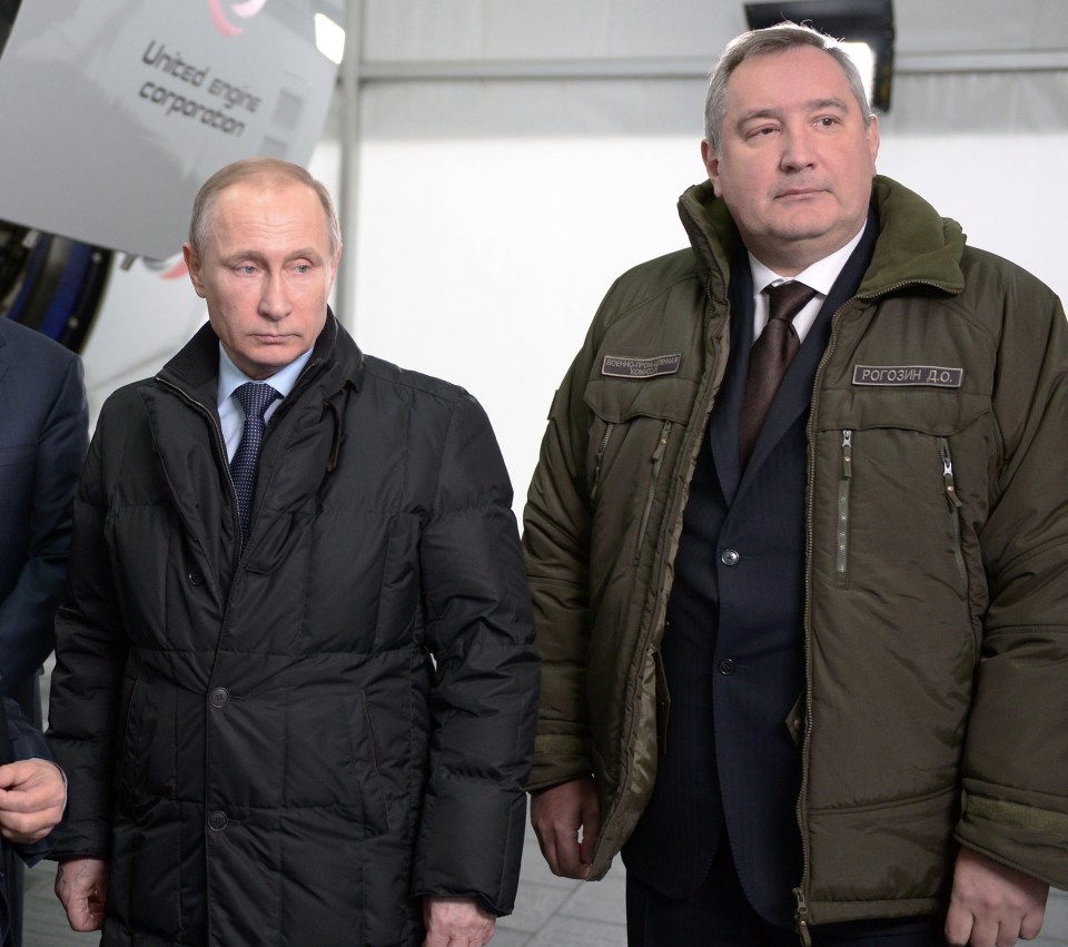 Russian Deputy Prime Minister Dmitry Rogozin, pictured here alongside President Vladimir Putin, says his country will develop legions of robots and drones to fight its enemies