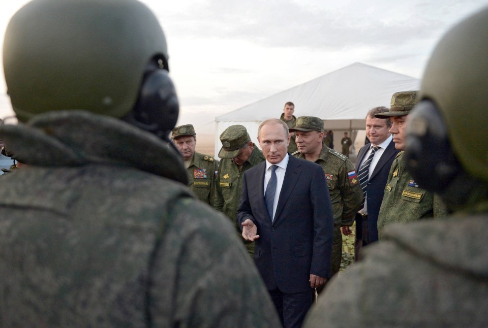 Putin meets his troops at a Russian military base