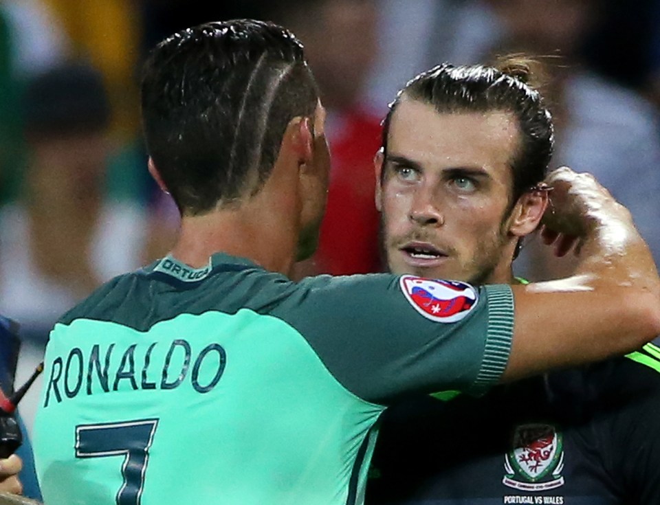  Gareth Bale and Cristiano Ronaldo embrace after Wales were knocked out of Euro 2016