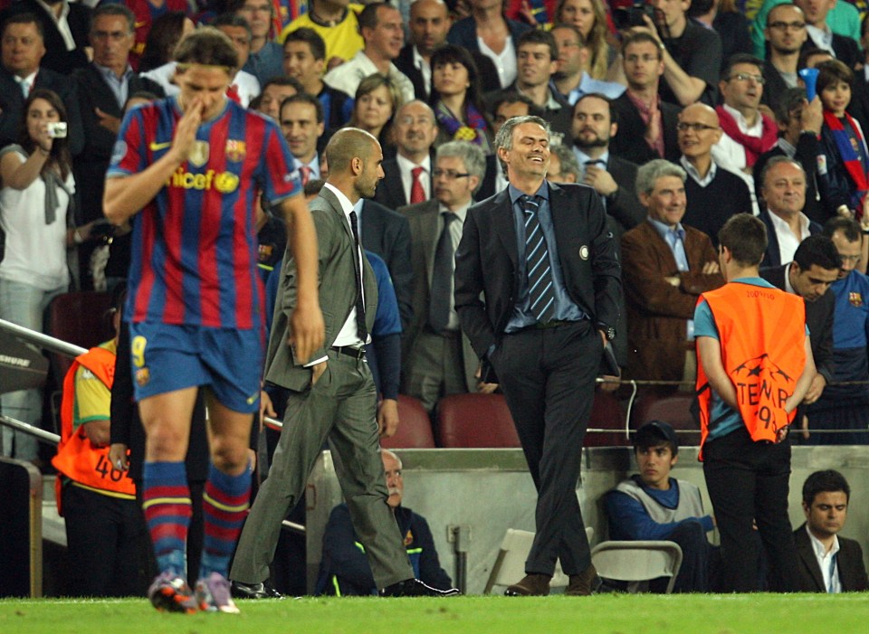  Jose Mourinho chuckles with Zlatan Ibrahimovic - who now plays for Manchester United - on the pitch for Barcelona