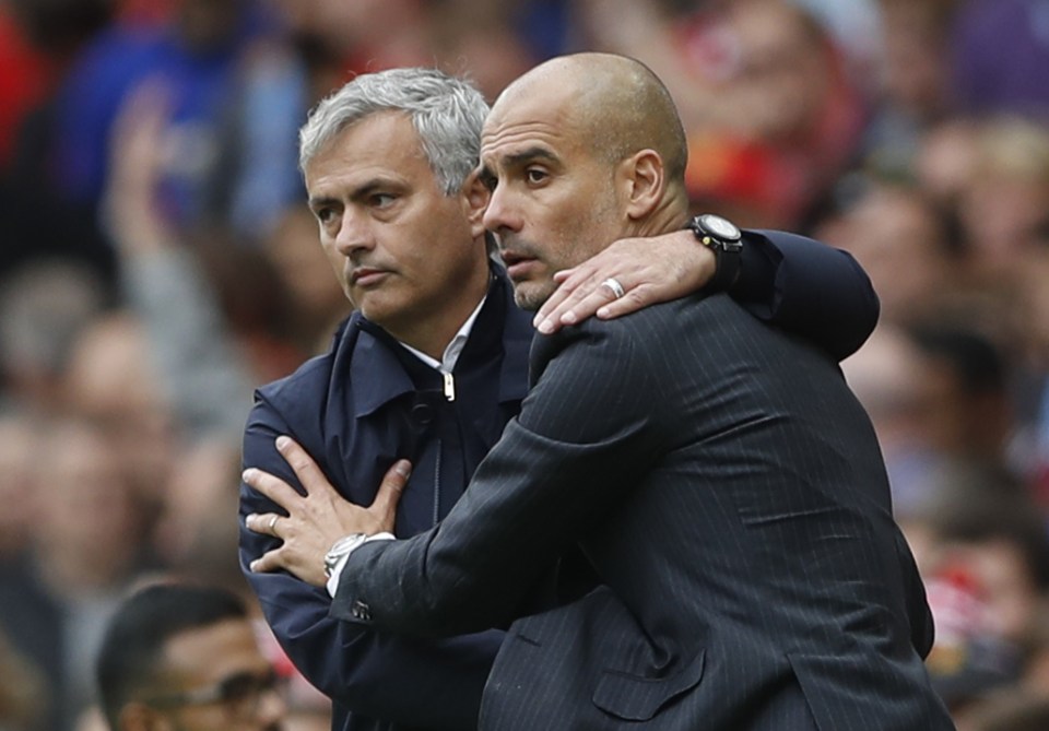  Jose Mourinho and Pep Guardiola embrace before the Manchester derby in September