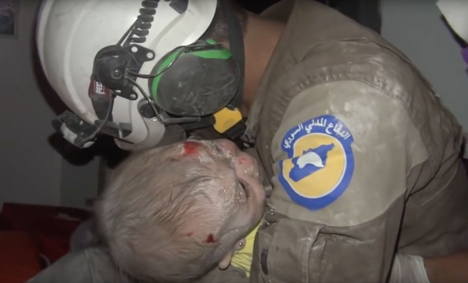 Rescue volunteer bursts into tears after rescuing a baby girl caught in Assad bombings