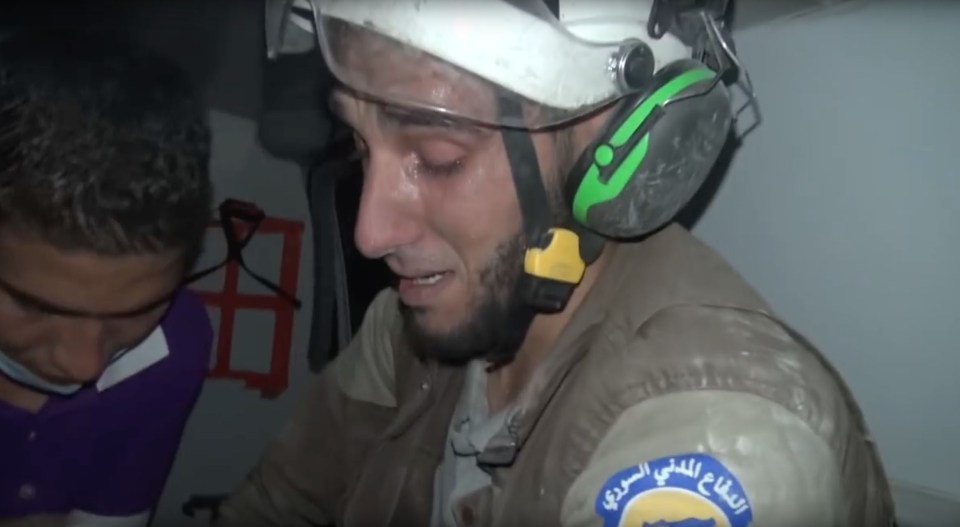 Rescue volunteer bursts into tears after rescuing a baby girl caught in Assad bombings