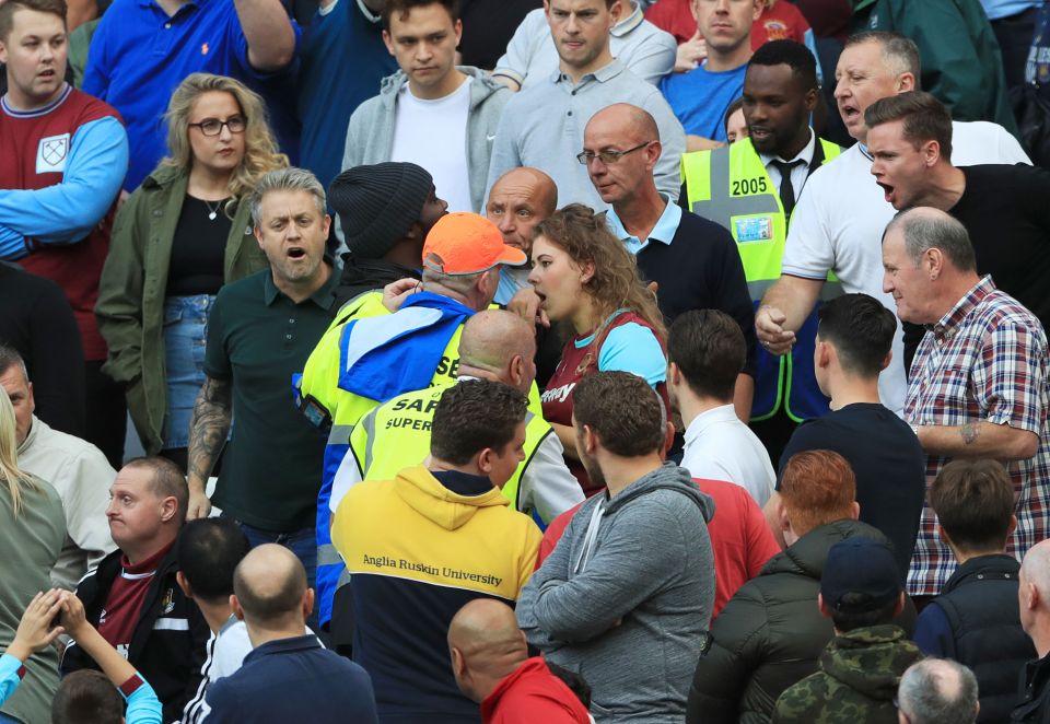  Stewards ask West Ham United fans in a corner of the stadium to sit down during a previous match at the Olympic Stadium