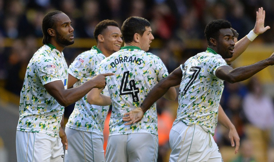  Norwich City kept pace with Huddersfield after a 2-1 win at Wolves