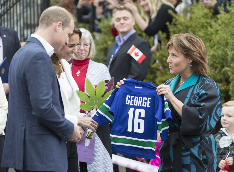 The couple were presented with personalised sports shirts for Prince George and Princess Charlotte