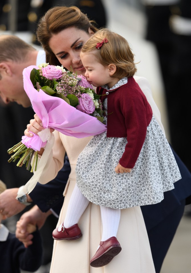 Kate shows Charlotte one of the many gifts they have received from well-wishers