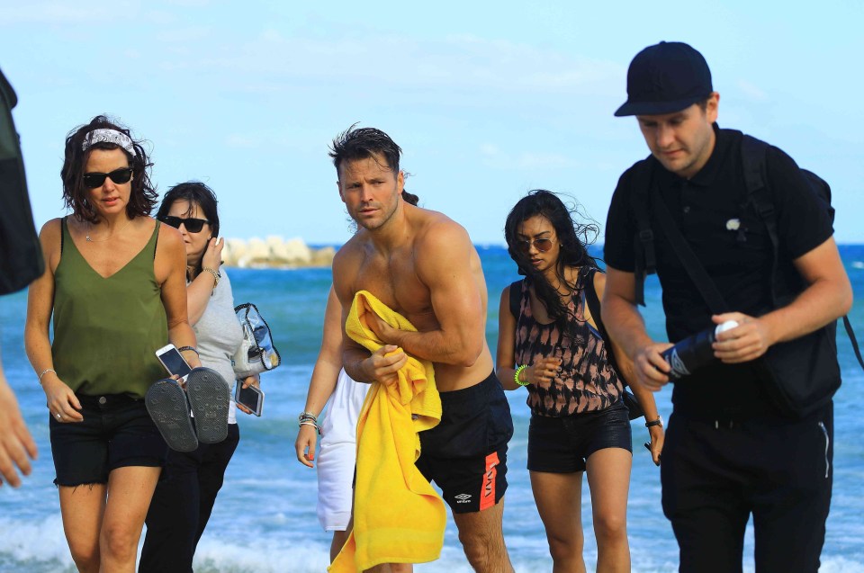  A bevy of helpers were there to hand a drenched Mark a much-needed towel