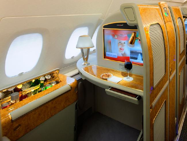 With a personal mini bar, Emirates' first class passengers can enjoy a high-altitude tipple in comfort and style