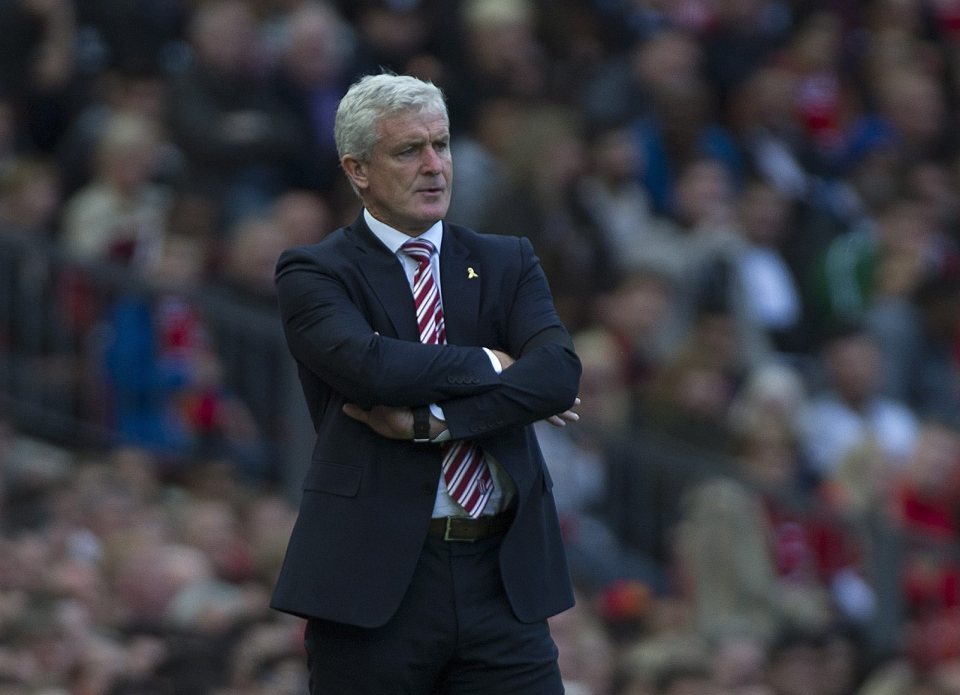  Mark Hughes watches on for Stoke