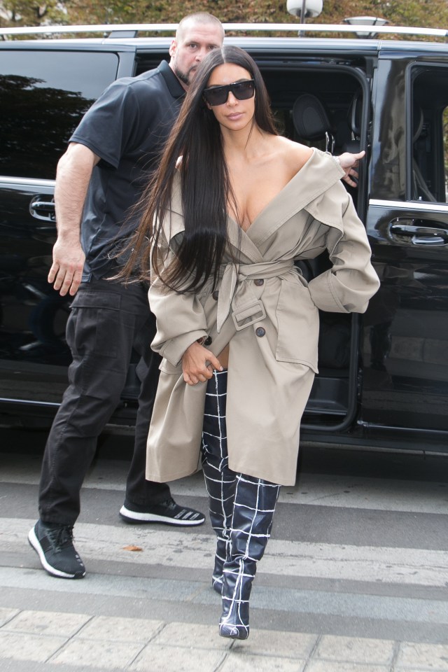 The coat hung off Kim's shoulders revealing plenty of cleavage in the process