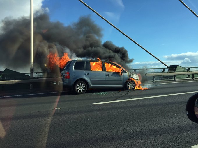  Burning car ... commuters were faced with 30 minute delays following incident