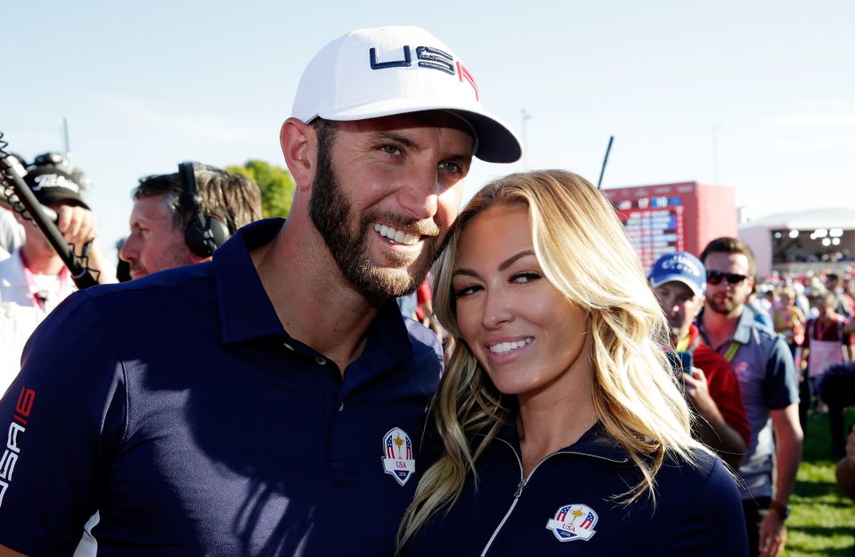  Dustin Johnson celebrates with fiancee Paulina Gretzky