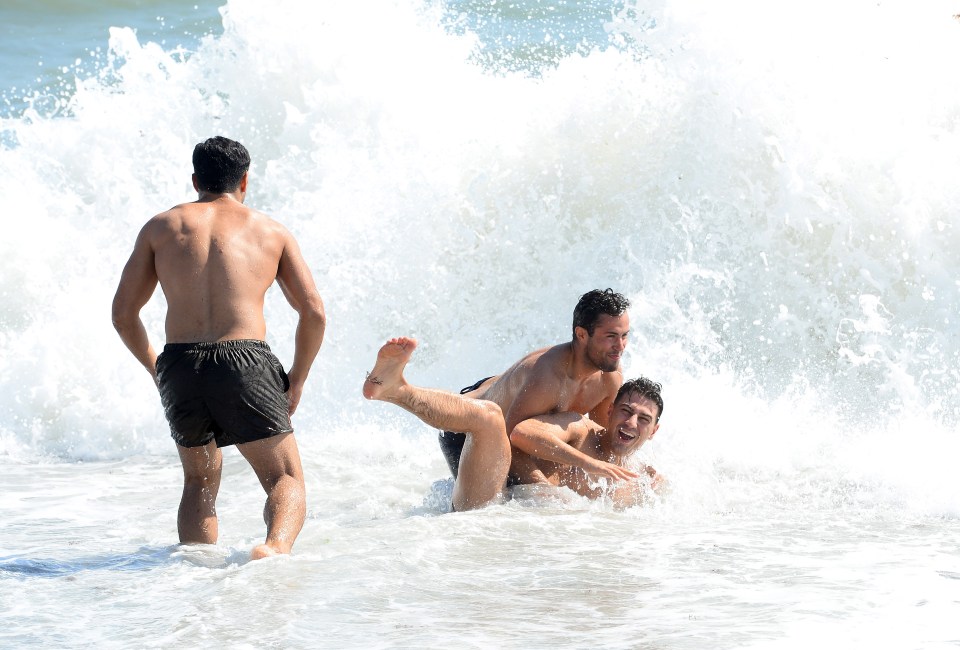 The TOWIE boys were spotted messing around in the waves