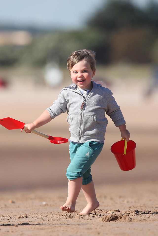  Two-year-old Harry Trebble Smith enjoyed the Indian Summer weather on the beach at Exmouth, Devon