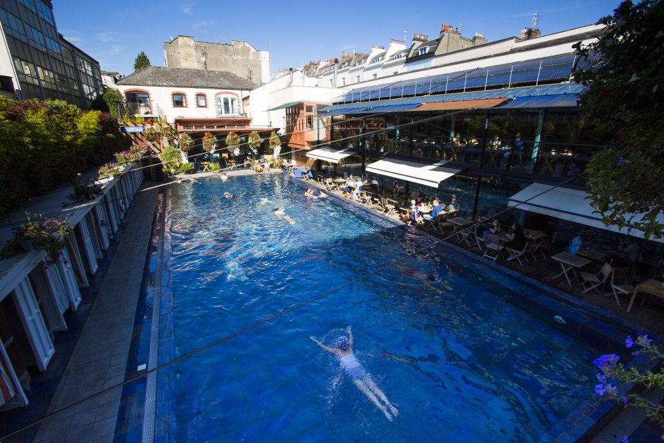  The outdoor pool was busy with swimmers on Monday despite temperatures only hitting the high teens