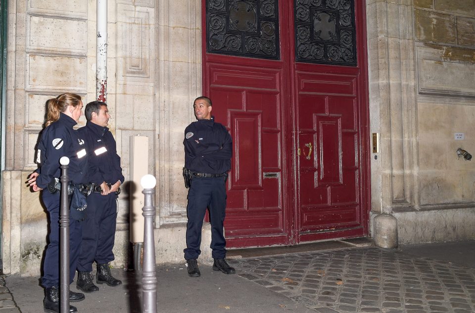  And French police, pictured here guarding Kardashian's flat, warned that her active social media presence could have made her a target