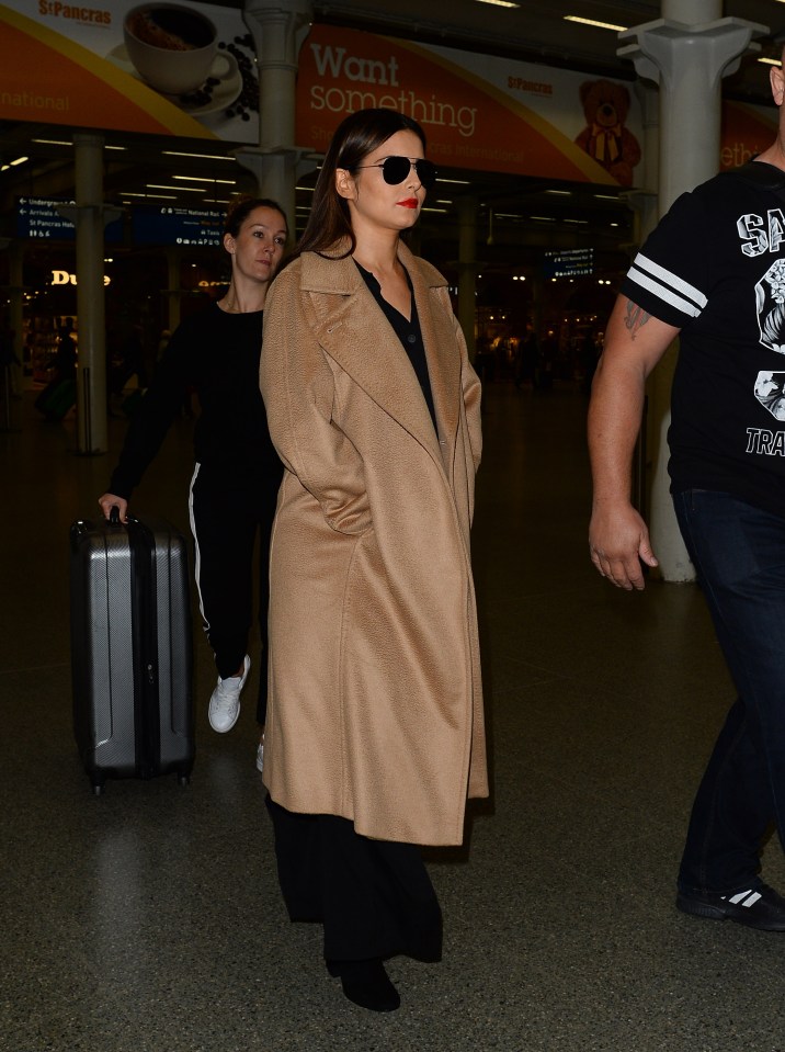  She was bundled up as she got off the Eurostar at Kings Cross on Monday evening