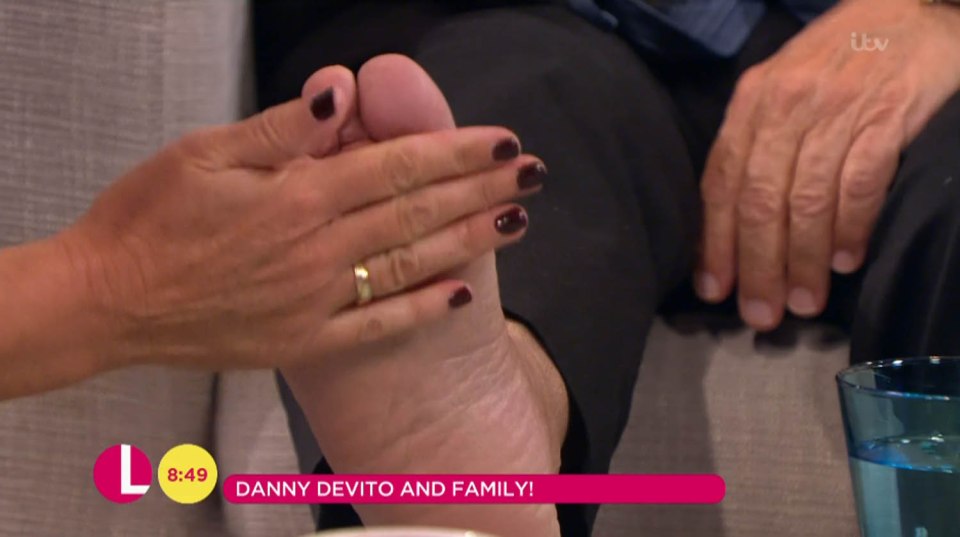 Lorraine stroked Danny's bare foot