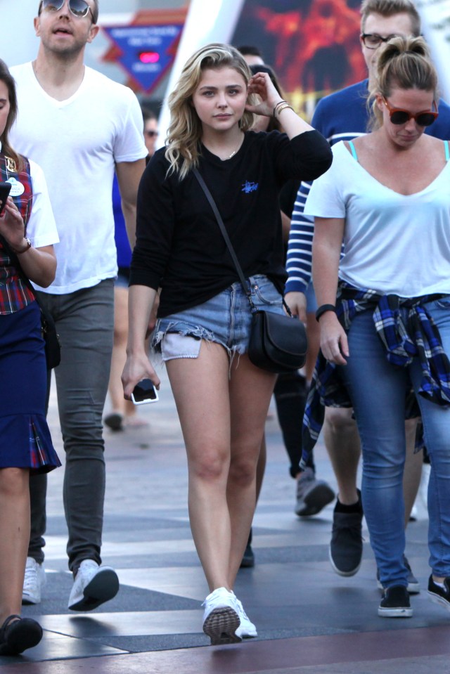  She was dressed down in a pair of Daisy Duke style denim shorts, black jumper and white trainers