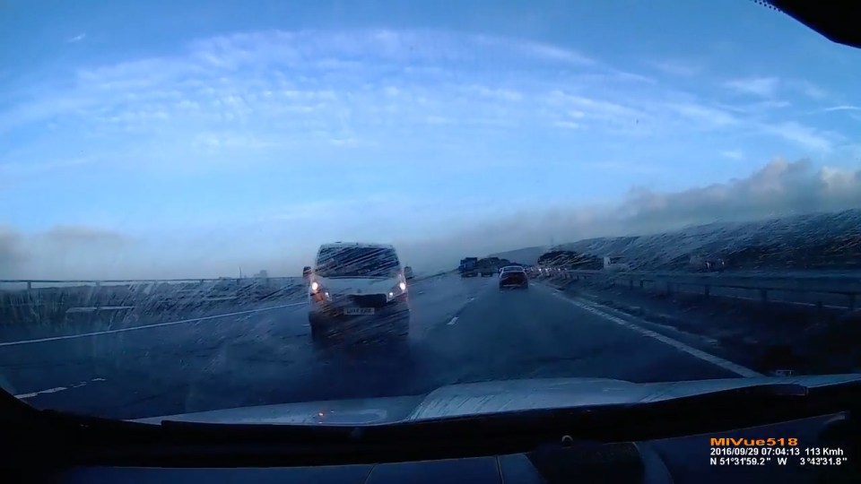  This is the terrifying moment a van spins out of control on the M4 motorway - missing another car by inches