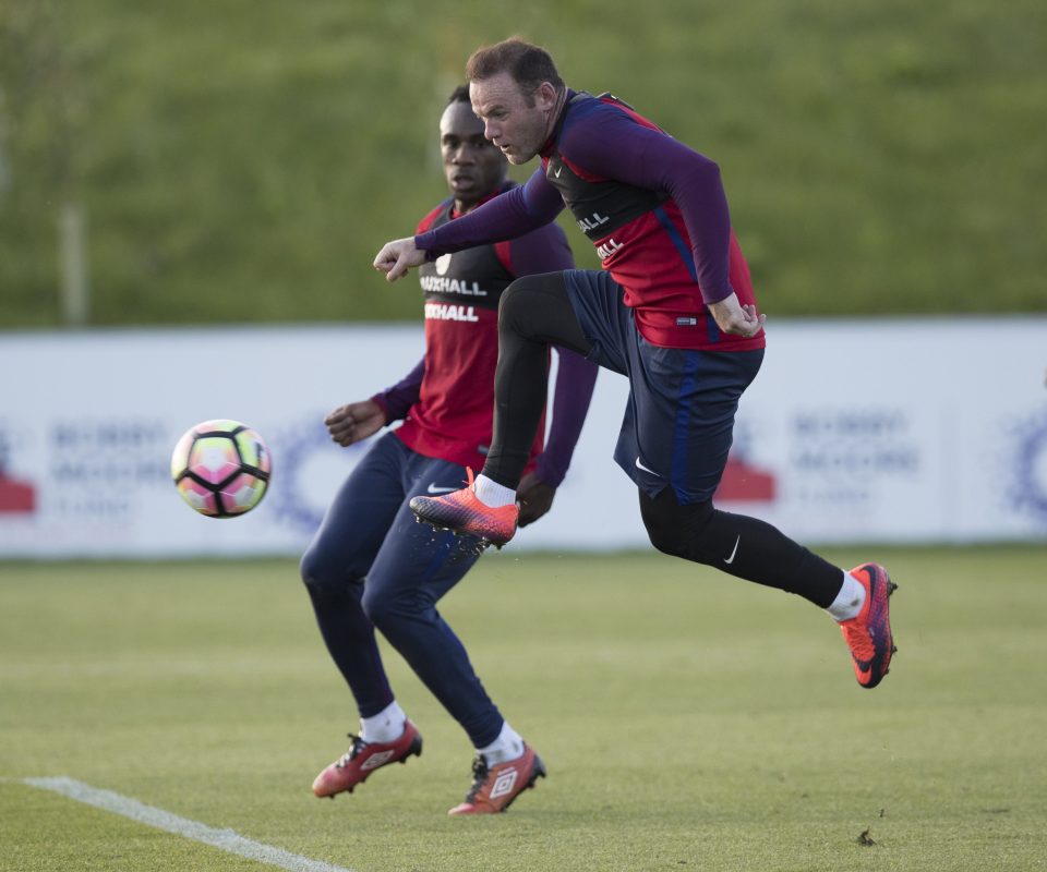  Wayne Rooney has a kick at a pass during training  yestrday