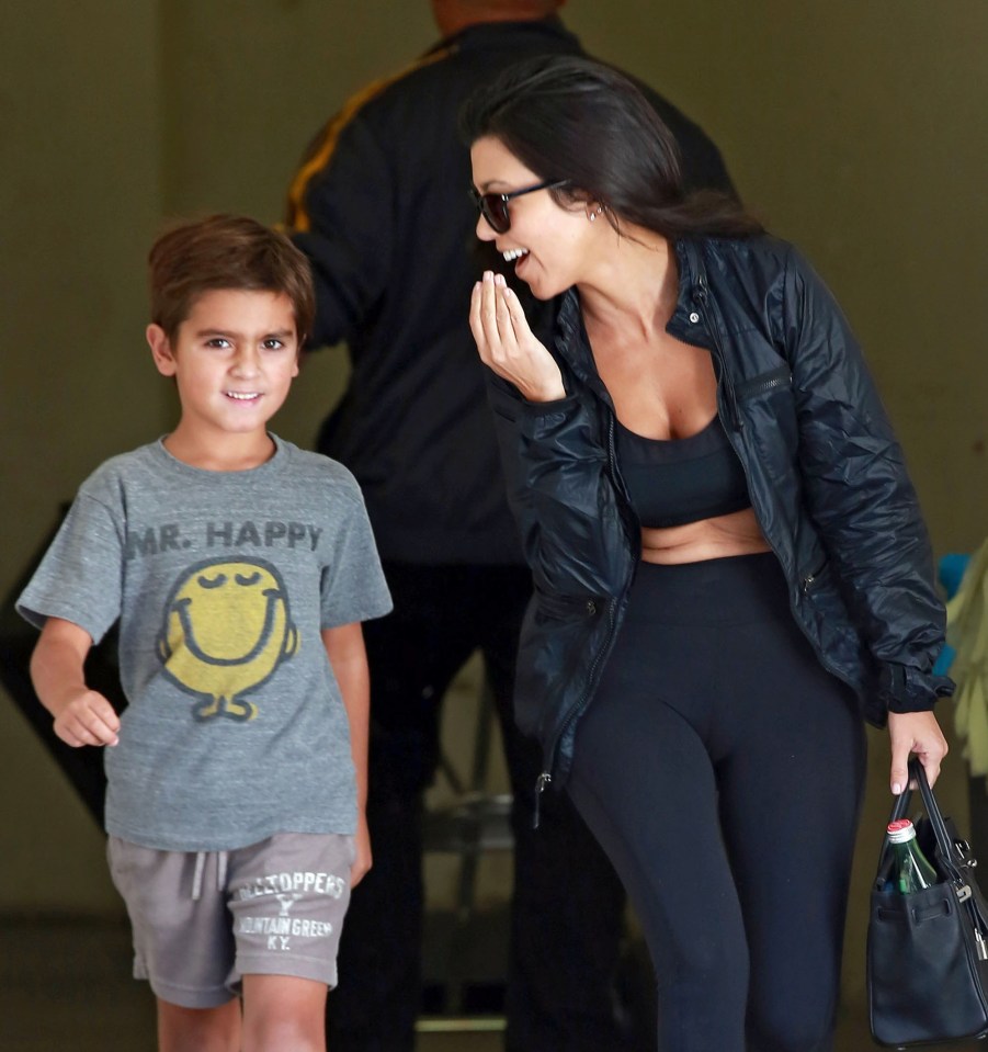  Kourtney looked in high spirits with Mason