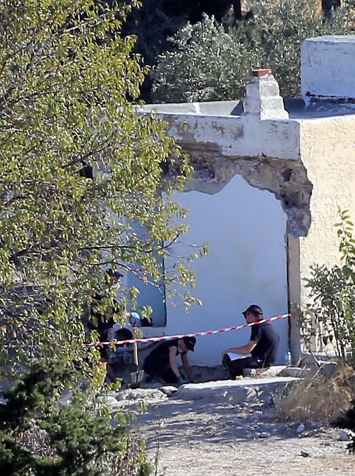  Forensics officers today work at the rear of the farmhouse where the extension was demolished