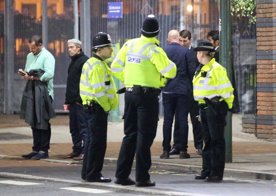  Police look on as Conservative Party conference delegates contemplate what to do next