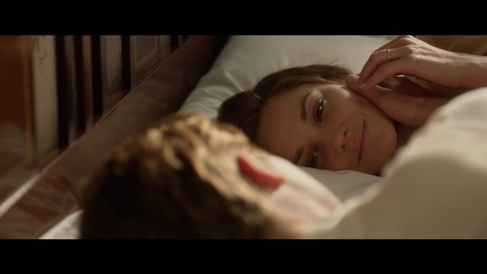 The couple are seen in bed together a number of times in the trailer 